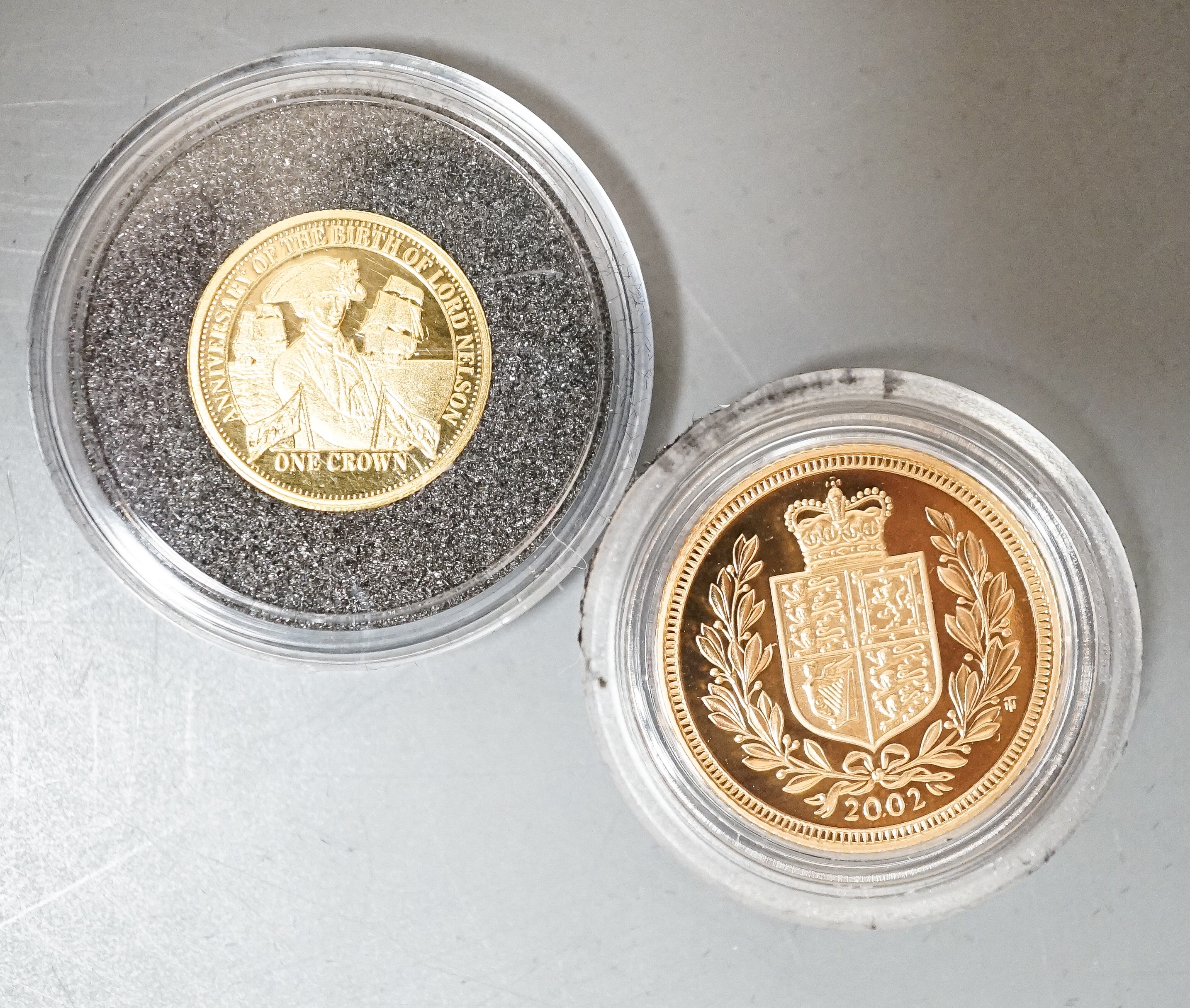 A Queen Elizabeth II gold proof half sovereign 2002 and a London mint Tristan Da Cunha gold piedfort one crown, cased with certificates (2)